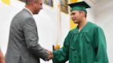 A graduate receives his diploma