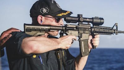 Navy commander relieved of duty after photo showed him firing rifle with scope backward