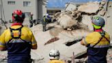 Rescue efforts for dozens missing in South Africa building collapse are boosted by 1 more survivor