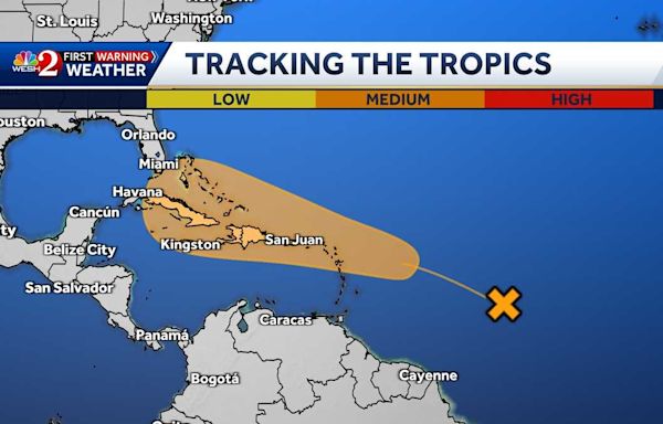 National Hurricane Center tracking tropical disturbance moving west