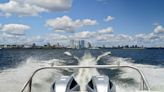 Heavily armed security boats patrol winding Milwaukee River during GOP convention