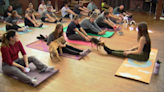 Rescue Puppy Yoga brings people and puppies together