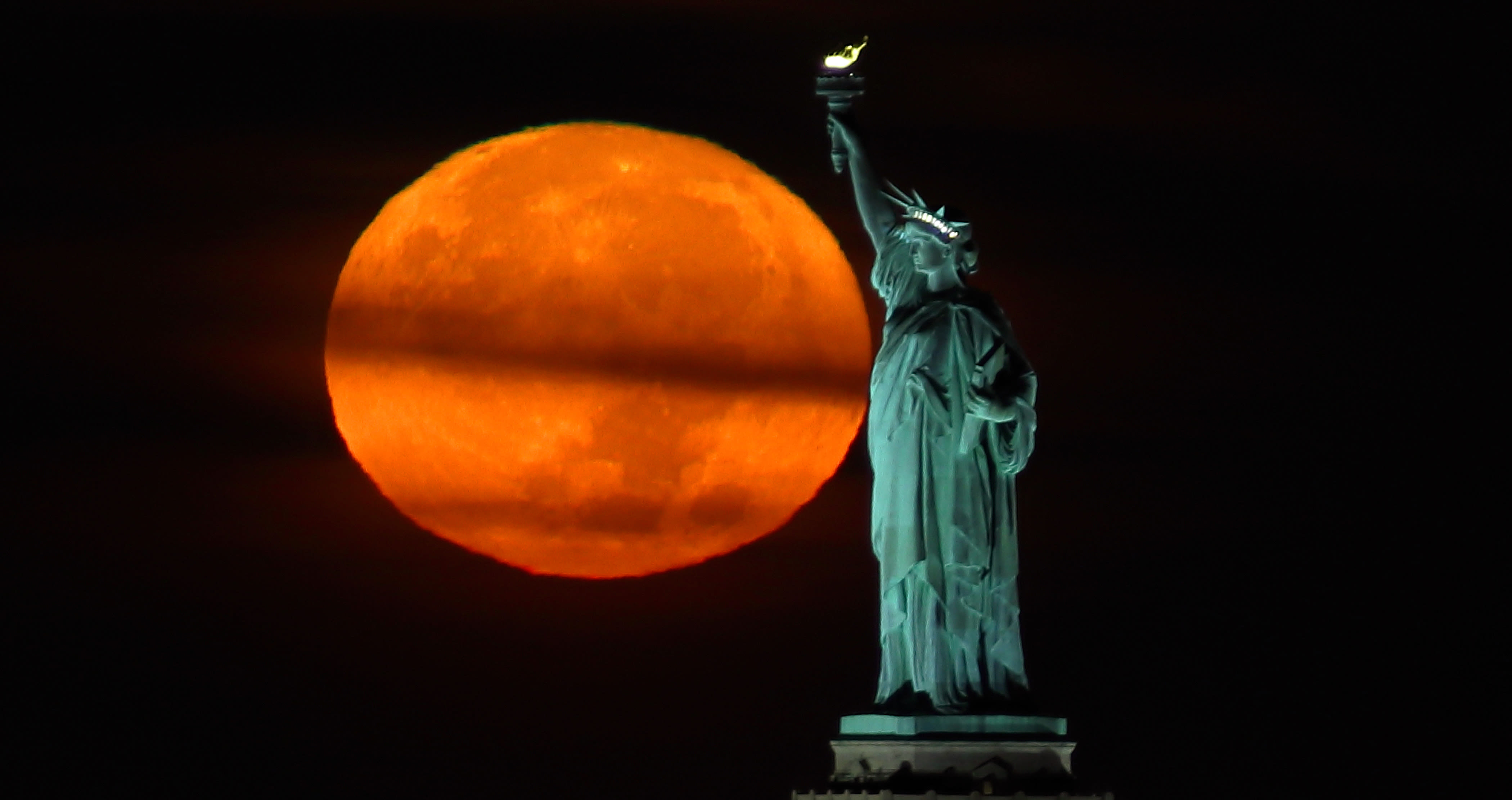 Tuesday's harvest supermoon will also be a partial lunar eclipse. How to best view the rare celestial event.