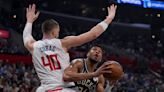 Damian Lillard scores 16 in the 4th quarter, and Bucks hold off short-handed LA Clippers 124-117