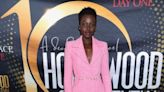 Lupita Nyong’o Is Pretty In Pink On The Hollywood Confidential Stage