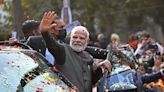Indian PM Modi steals limelight at lavish Ambani wedding as route to the ceremony lined with posters