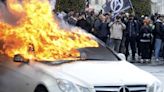 Police and protesters clash in 12th day of French rallies against pension reform