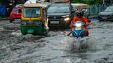 A tropical storm floods villages and cuts power to millions in parts of Bangladesh and India