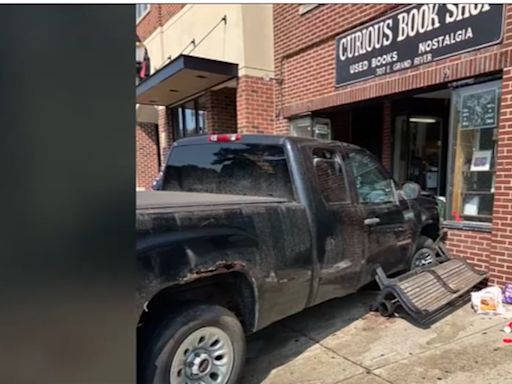 Car crashes into bench near Curious Book Store, driver flees the scene