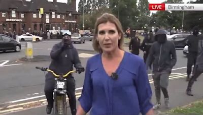 Moment Sky News reporter is harassed by protester in Birmingham