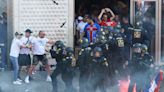 Watch: Serbia fans chant Vladimir Putin’s name amid violent clashes with German police