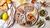 Tinned Fish Is The Key To Deliciously Affordable Charcuterie Boards