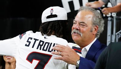 WATCH: Texans QB C.J. Stroud joins Luke Combs on stage at NRG Stadium, owner Cal McNair shotguns beer