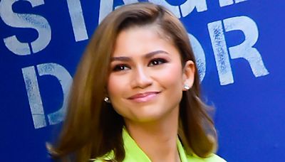 Zendaya stuns in a low-cut neon green dress as she promotes Challengers on GMA