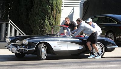 Ashton Kutcher gets help pushing his Corvette after it broke down