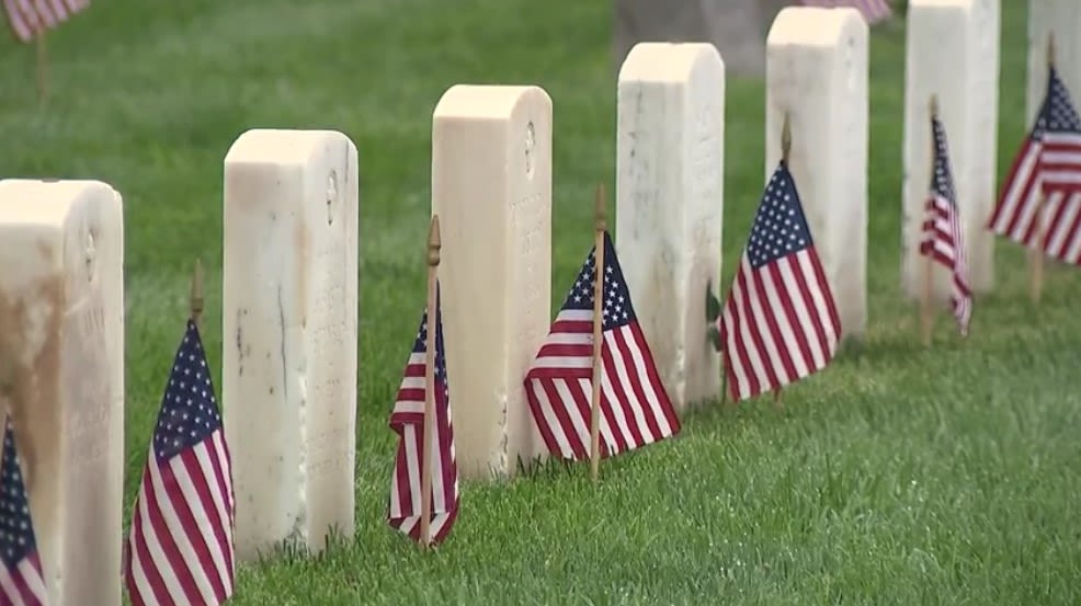 Thousands of American flags are placed on gravesites at Miramar National Cemetery