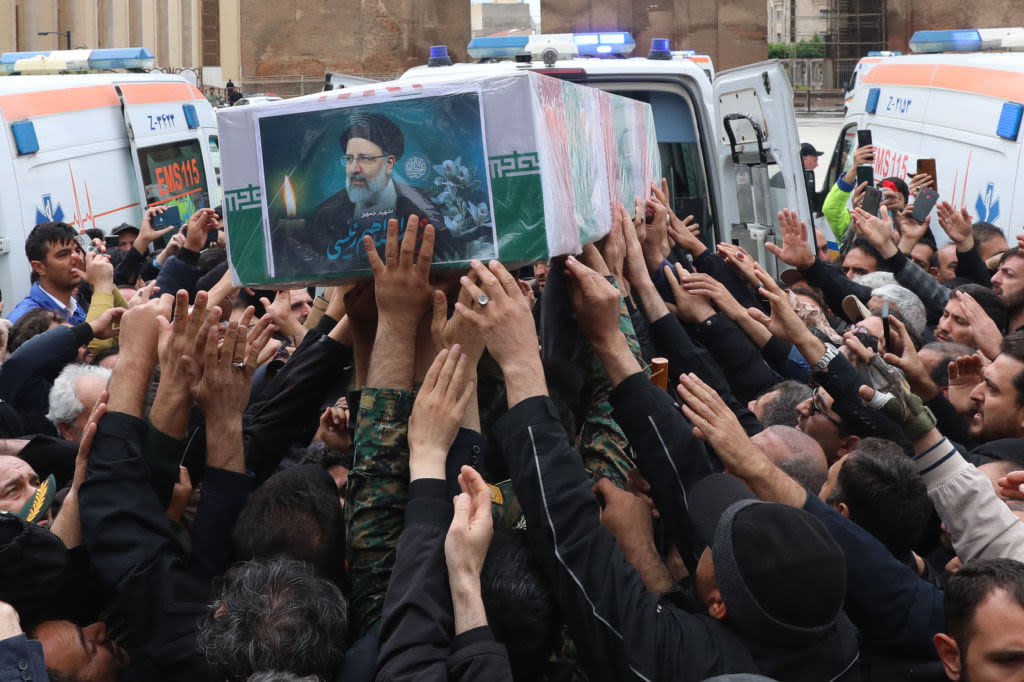Thousands Attend Raisi's Funeral, as Others Celebrate
