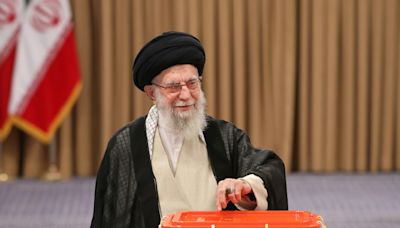 Calling for better ties with West, Iran reformist wins presidency
