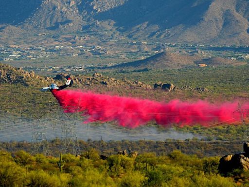 More residents in parts of Arizona’s most populous county asked to evacuate as a wildfire threatens homes