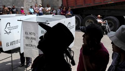 The Latest | Mexico votes in historic elections marred by cartel violence and deep division