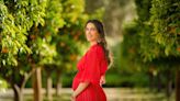 Princess Rajwa Glows in Ruby Red Maxi Dress in First Maternity Portrait