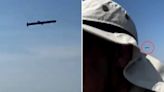 Moment low-flying Russian cruise missiles skim over fishermen’s heads