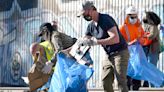 Newsom calls littered LA rail tracks ‘unacceptable,’ brings along cleanup crew