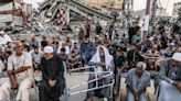 Palestinians gather at ruined mosque for Eid al Adha prayers - as Muslims celebrate around the world