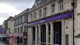 Woman dies outside Torquay bank