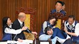 Taiwan lawmakers exchange blows in bitter dispute over parliament reforms