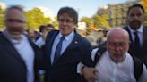 How has Carles Puigdemont managed to evade arrest on his return to Spain?