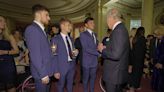 King makes a splash with Olympic stars at palace reception