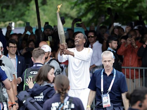 Snoop Dogg stars as flame sails into Paris for opening ceremony