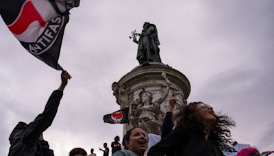 French protesters set off fireworks and damage Paris storefront after far-right election result