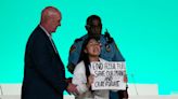 Indian climate activist, 12, ‘kicked out’ of Cop28 for storming stage demanding action