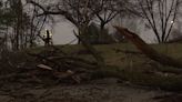 Neighbors clean up debris after overnight storms in Holt, Mason