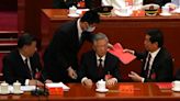 China's former leader, Hu Jintao, helped off stage at party congress in Beijing