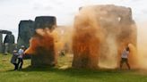 UK police arrest pair after Stonehenge sprayed with orange substance