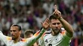 Germany's Niclas Fuellkrug (R) celebrates his equaliser against Switzerland