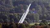 Latvia brings down Soviet-era monument's obelisk in capital