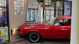 A Classic Ford Mustang Drives Into A Liquor Store