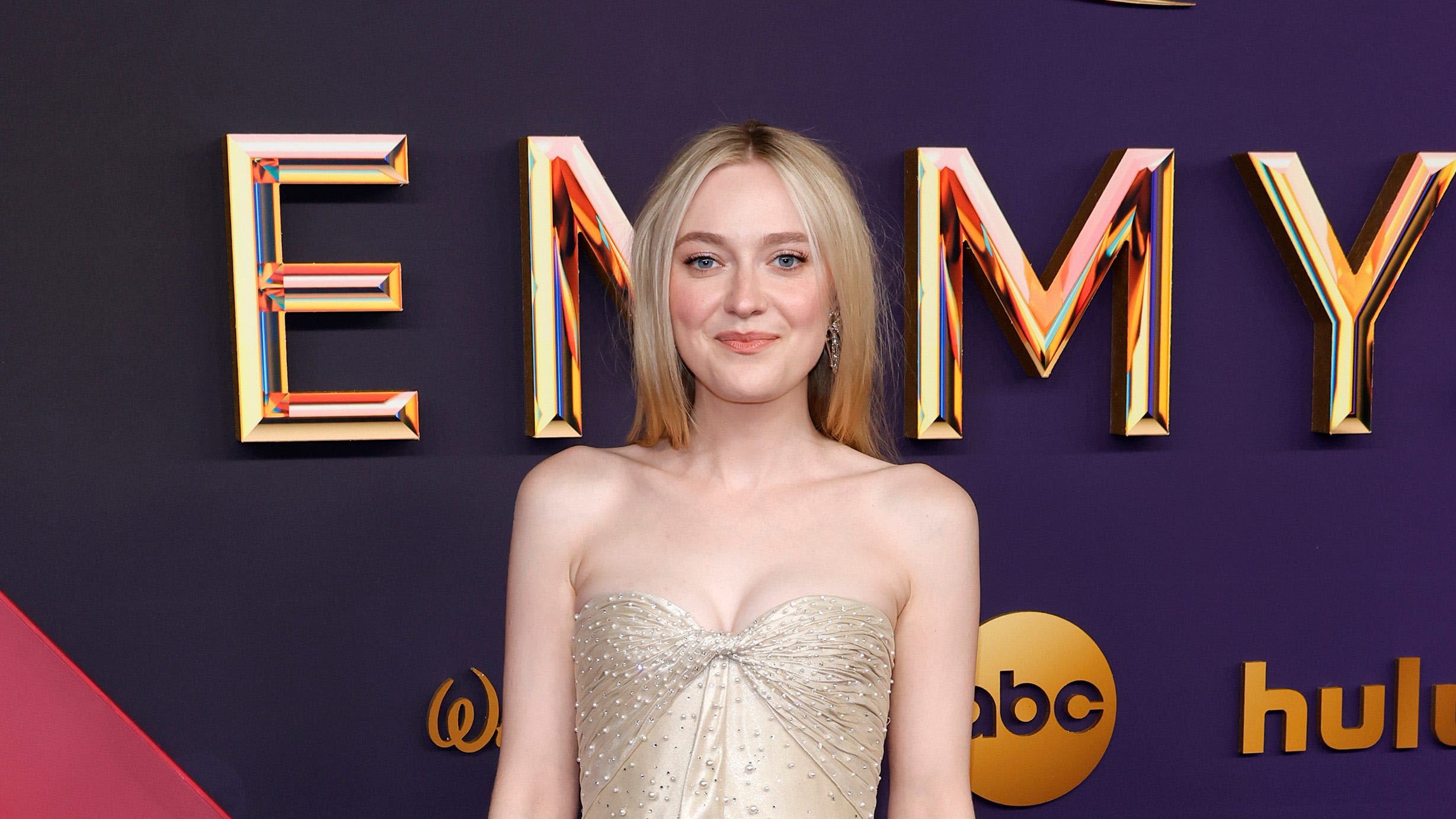 Dakota Fanning Glows in a Champagne Gown Dotted With Pearls at the Emmys