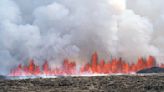 Iceland volcano dramatically erupts again as streams of lava reach town’s defensive walls