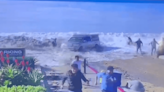 Watch a Huge Rogue Wave Wipe Out a Truck and Innocent Bystanders