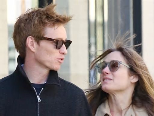 Eddie Redmayne puts on a loved-up display with wife Hannah Bagshawe as they saunter arm-in-arm around New York City where the actor is starring in the Broadway revival of Cabaret