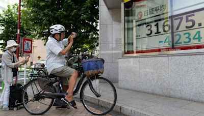 Global stock markets are sliding as Japan suffers biggest fall since 1987