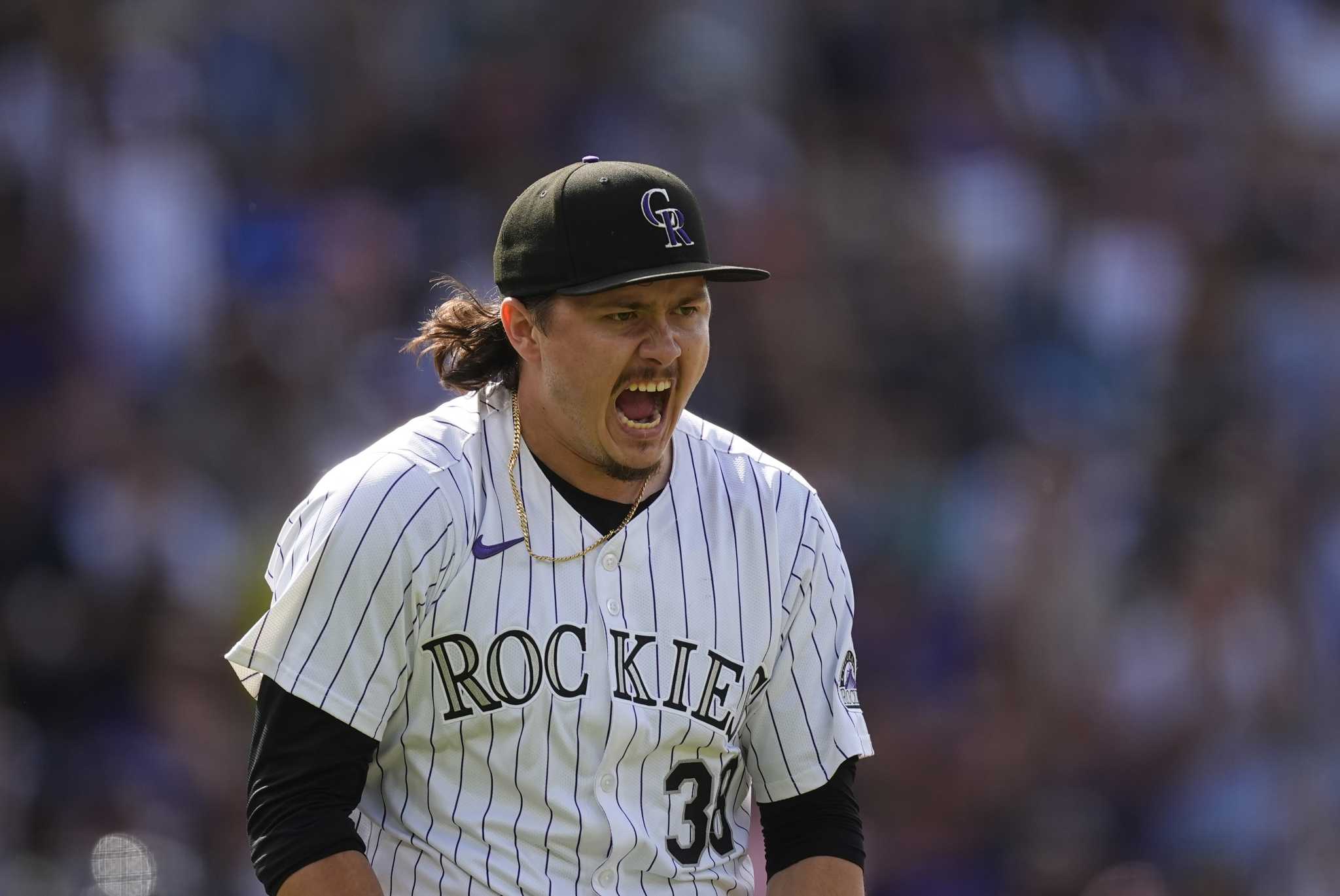 Rockies score 7 runs in the 8th in come-from-behind 9-8 win over the Braves