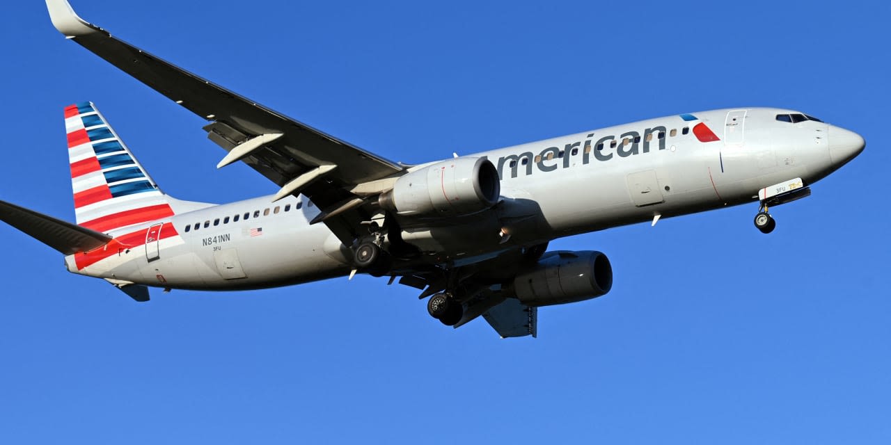 American Airlines drops its upbeat profit guidance, and stock drops 8%