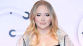 YouTuber NikkieTutorials got married in a ball gown with sheer, crystal-encrusted sleeves that showed her tattoos