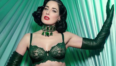 Burlesque star Dita Von Teese, 51, shows off her curves in green lingerie